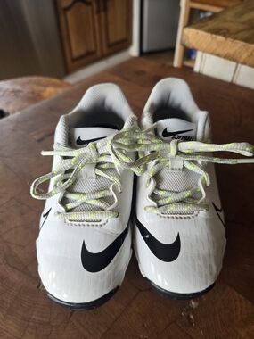 Nike Kids White Sneakers with Black Swoosh and Neon Accents